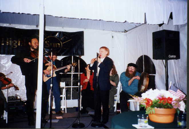 Photo of Paddy Moloney playing with the band